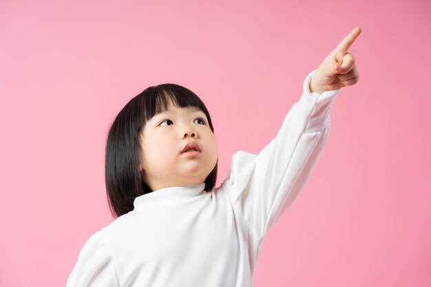 Lovely baby girl portrait isolated on pink background