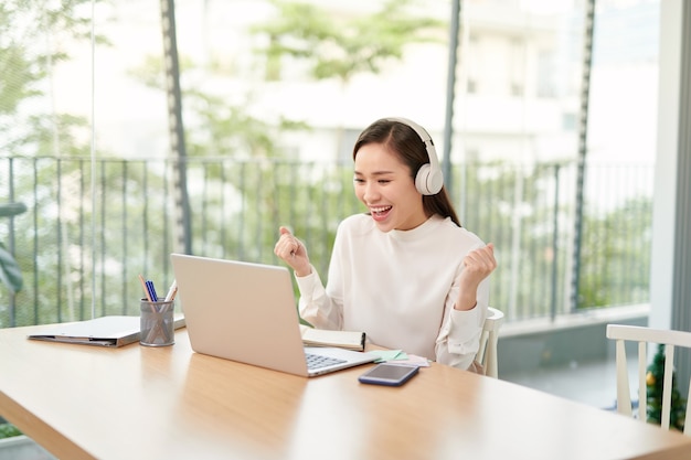 Lovely beautiful young woman using her laptop