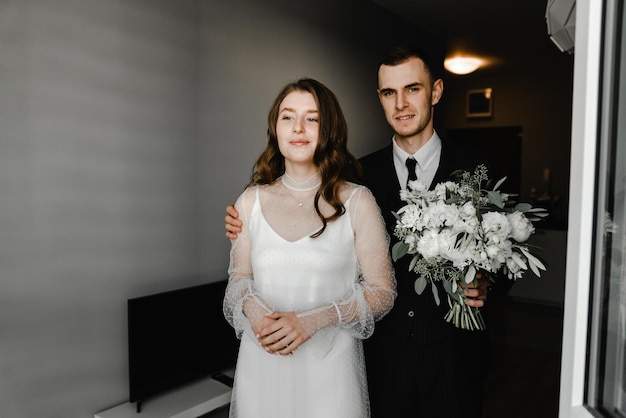 Lovely bride waiting for the first meeting with the groom. meeting the newlyweds at the wedding. beautiful and happy couple kissing and hugging