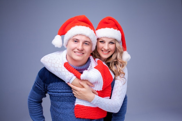 Lovely christmas couple in santa claus hats