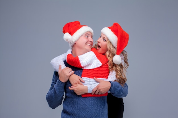 Lovely christmas couple in Santa Claus hats