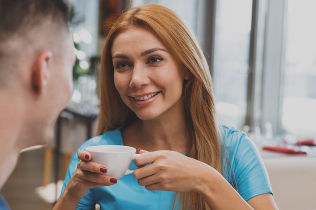 Lovely couple enjoying breakfast together at the restaurant