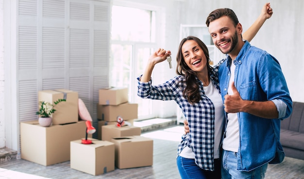 Lovely couple feels very ecstatic about their recent purchase of a new home which makes them feel being on the verge of happiness