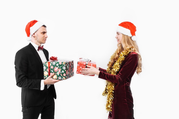 Lovely couple giving Christmas gifts