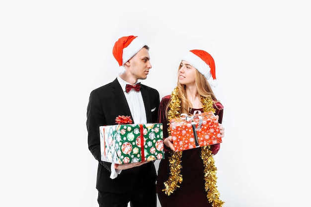 Lovely couple giving Christmas gifts