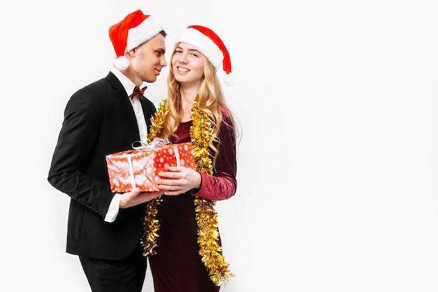 Lovely couple giving Christmas gifts