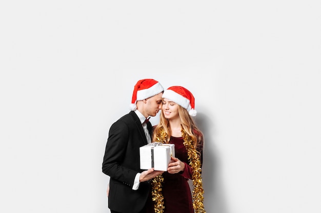 Lovely couple giving Christmas gifts