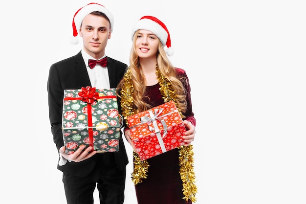 Lovely couple giving Christmas gifts