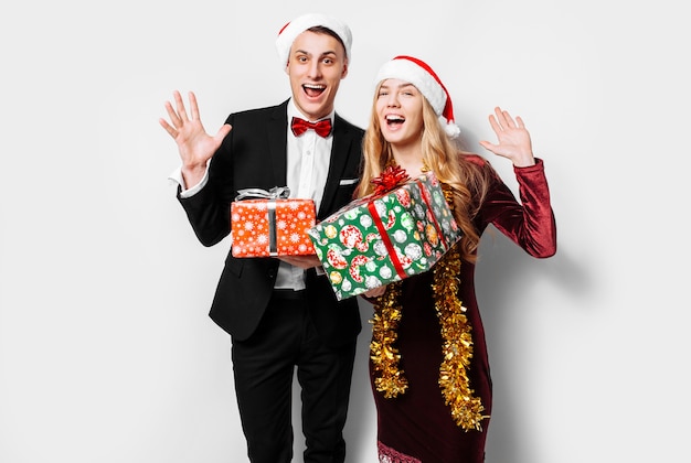 Lovely couple giving Christmas gifts