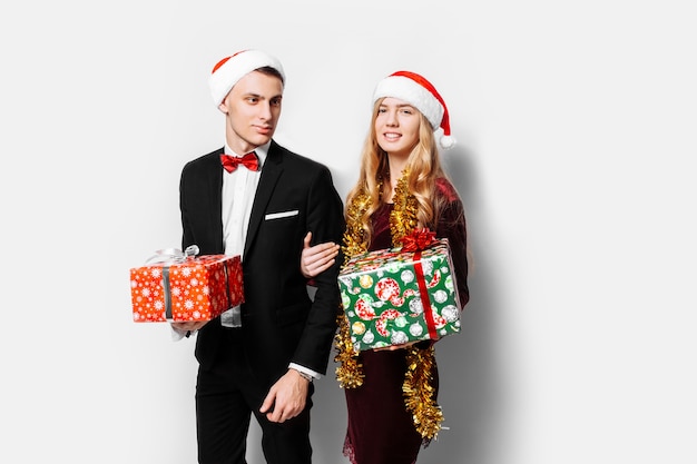 Lovely couple giving Christmas gifts