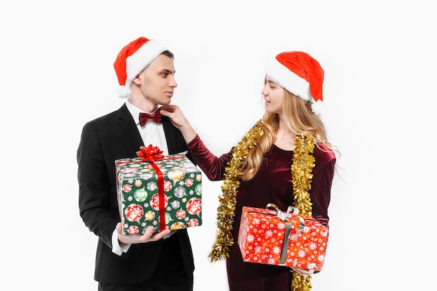 Lovely couple giving Christmas gifts