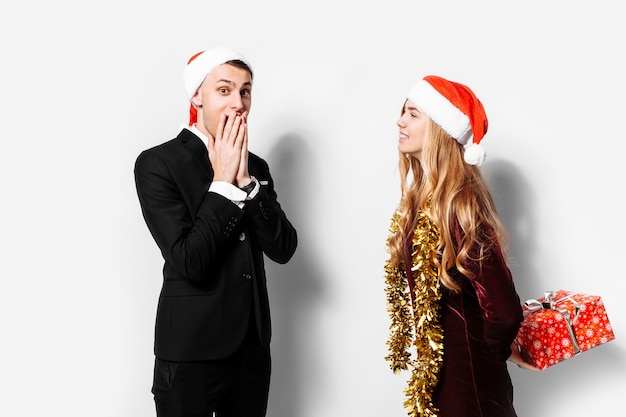 Lovely couple giving Christmas gifts