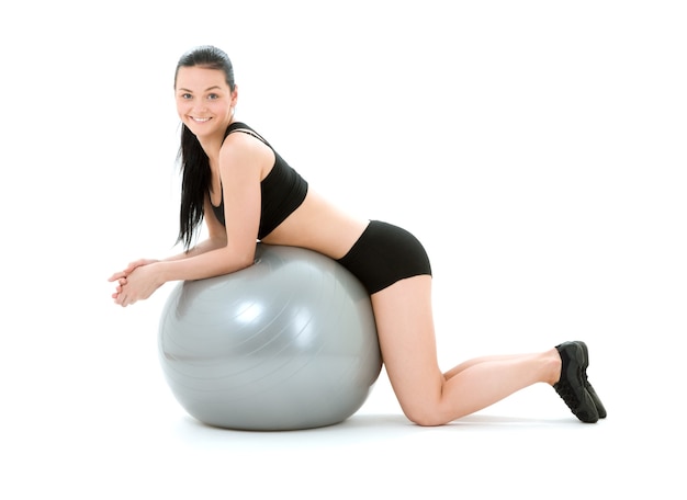 lovely fitness instructor with pilates ball