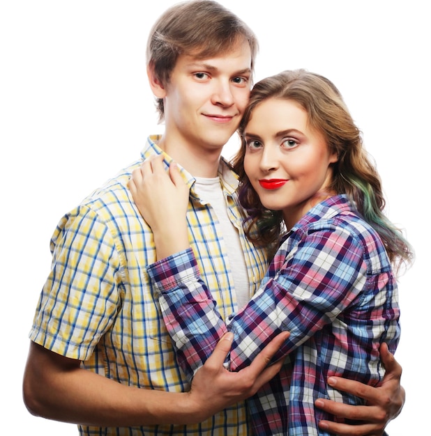 lovely happy couple hugging over white background