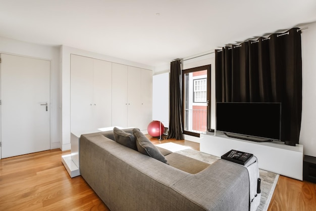 Lovely little living room with grey sofa