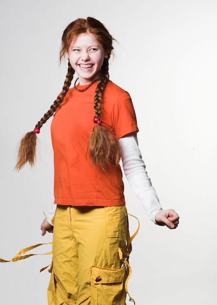 Lovely redhead girl with long braids