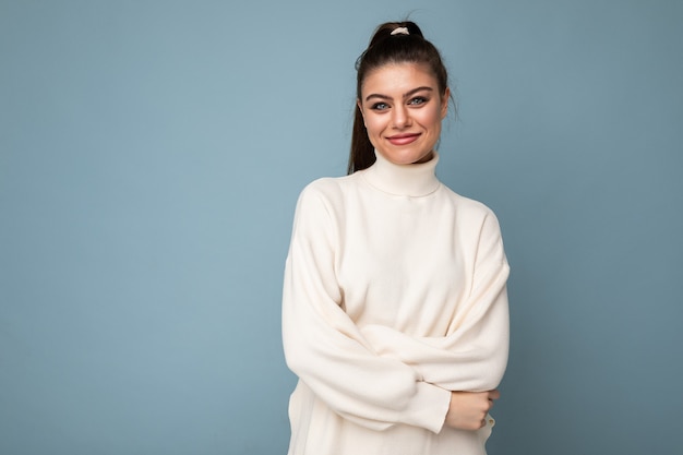 Lovely smiling young woman wearing warm sweater