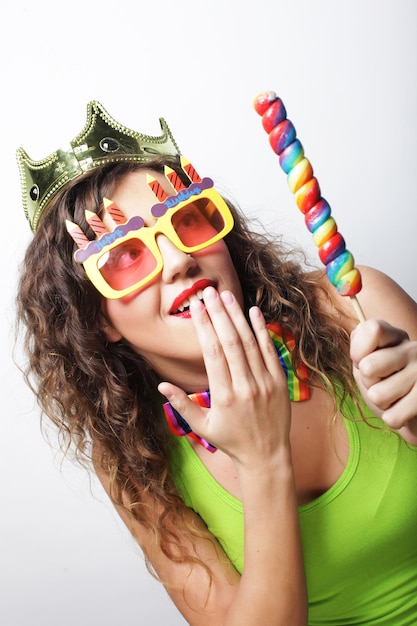 Lovely woman with crown and funny sunglasses