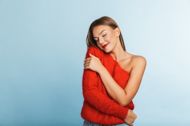 Lovely young woman wearing sweater standing