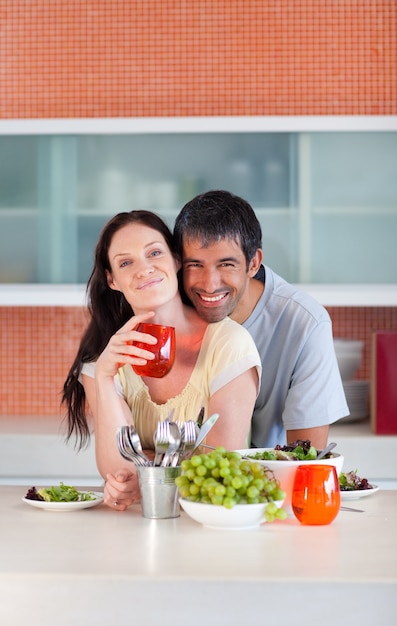 Lovers eating in the kitchen