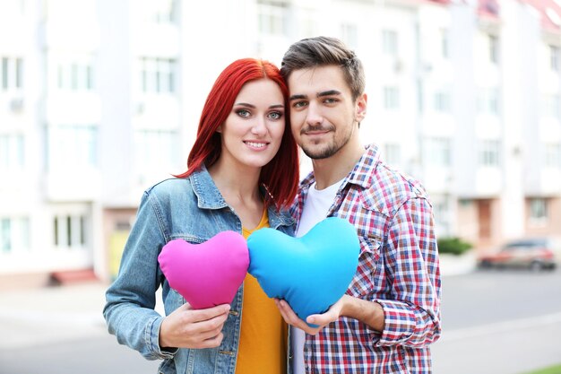 Loving couple near apartment house