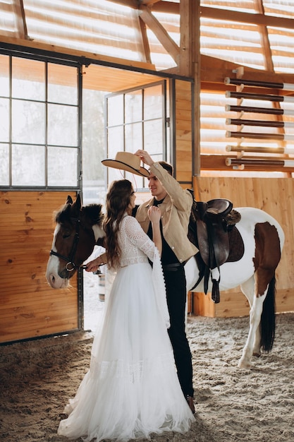 Loving couple on a ranch in the west in the winter season