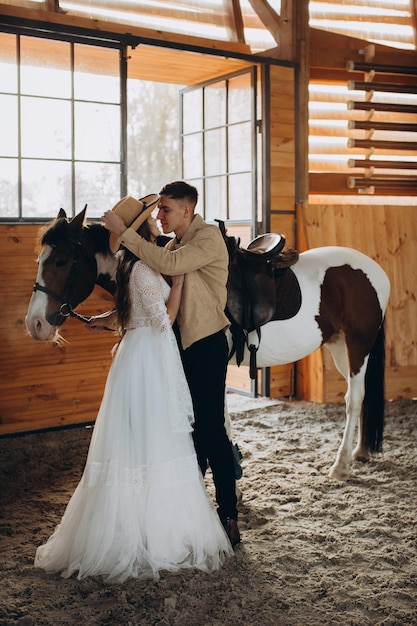 Loving couple on a ranch in the west in the winter season