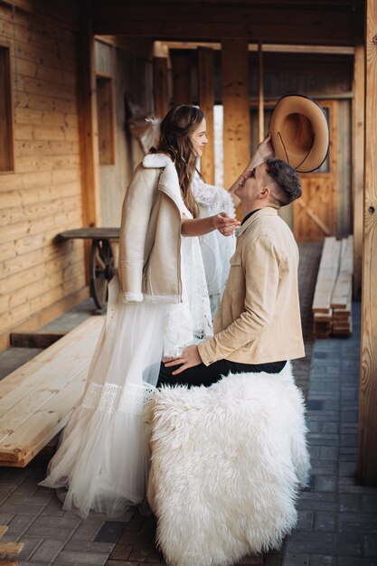 Loving couple on a ranch in the west in winter