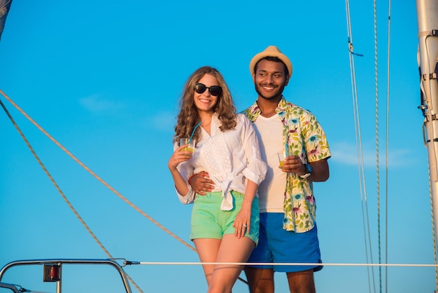 Loving couple relaxing on a yacht