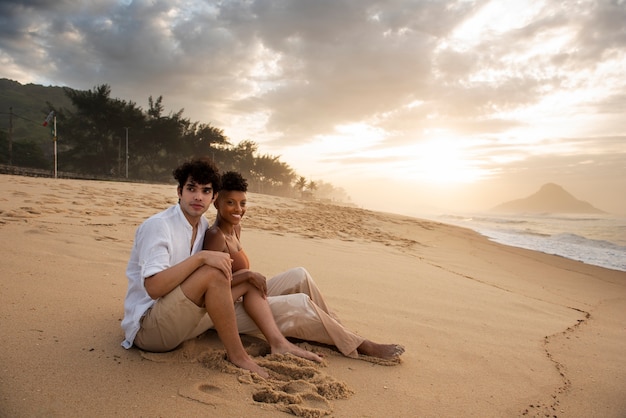 Loving couple showing affection on the beach near the ocean