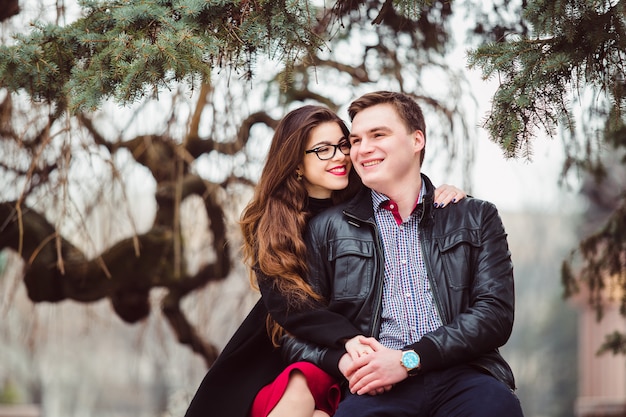 Loving couple sitting on a bench