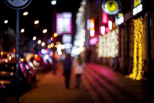 loving couple walks on a night city. background bokeh