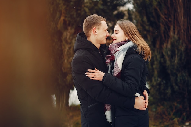 loving couple wallking in a snowy park