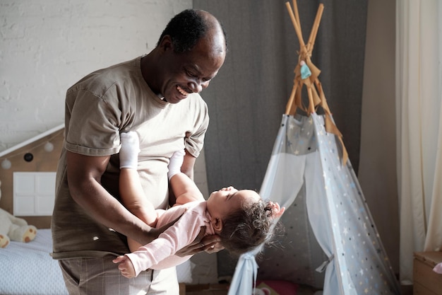 Loving dad and playful baby