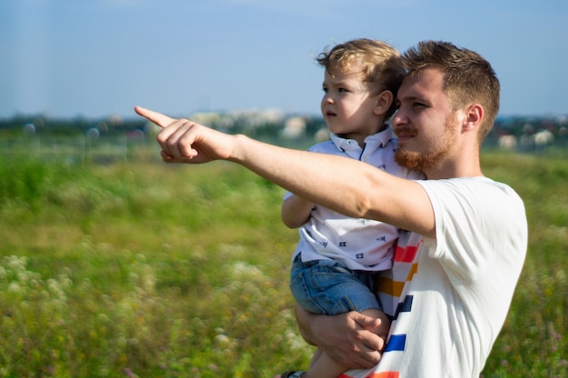 Loving family. Father and his son baby boy playing and hugging outdoors. Happy dad and son outdoors. Concept of Father's day.