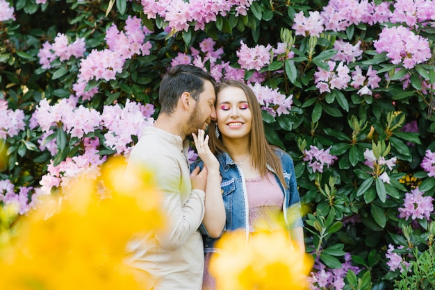 Loving guy and girl enjoy each other, smile and happy spring