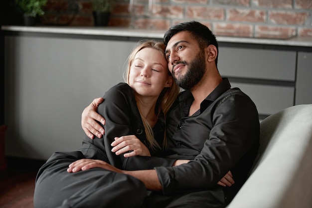 Loving husband and wife dream sitting on the couch