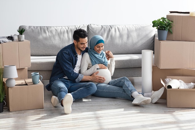 Loving muslim family waiting for baby, moving to new house