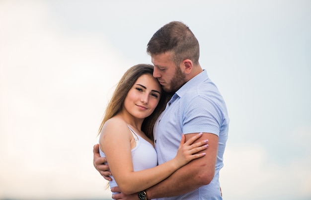 Loving people. valentines day. sexy girl with her boyfriend outdoor. man and woman embrace. family values. romantic relationship. love date. couple in love. family relations and happiness.