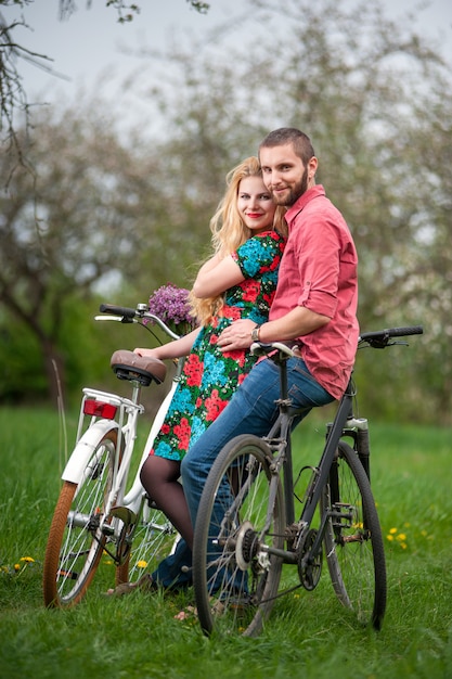 Loving young couple with bicycles