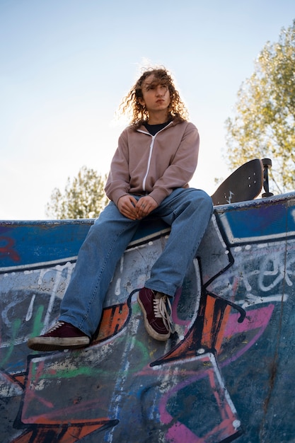 Low angle rebel teen in skatepark