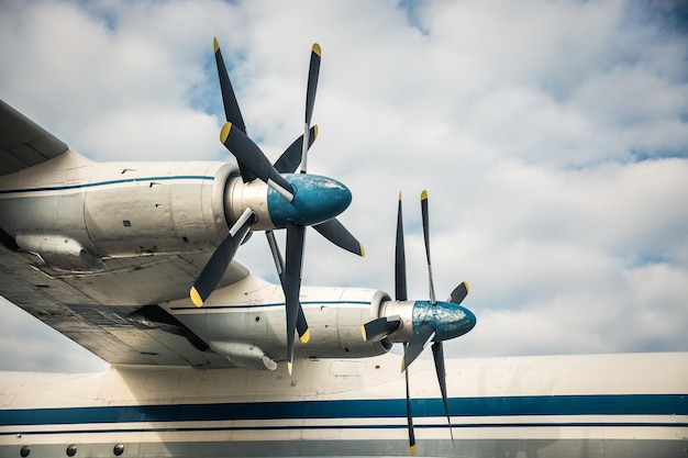 Low angle view of airplane against cloudy sky