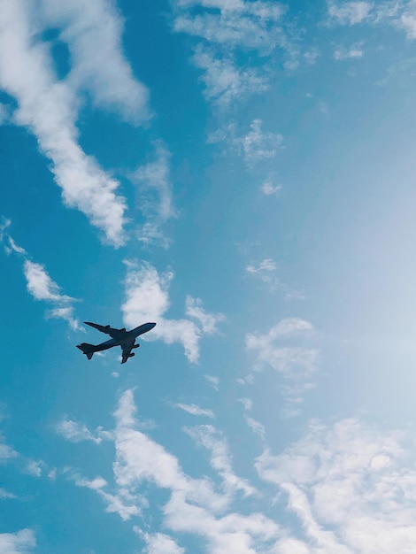 Low angle view of airplane flying in sky