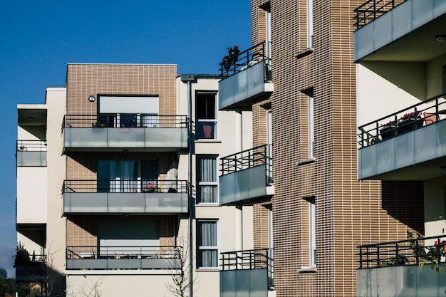 Low angle view of buildings against clear blue sky