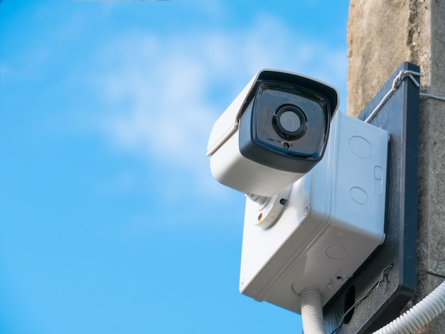 Low angle view of camera against blue sky