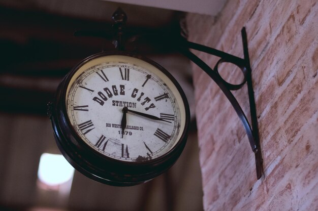 Low angle view of clock on wall