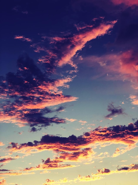 Low angle view of clouds in sky during sunset