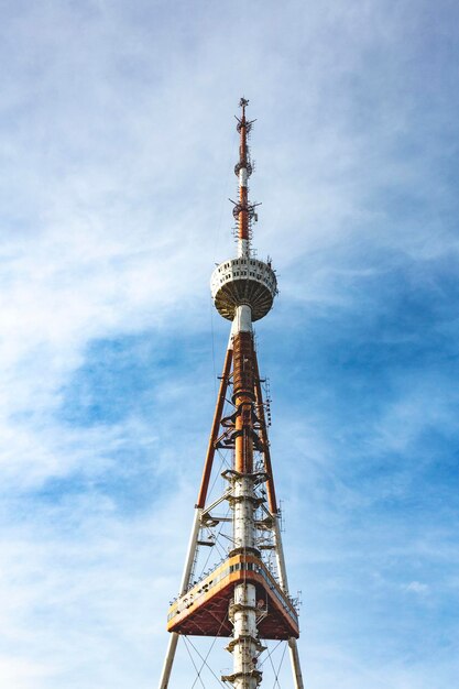 Low angle view of communications tower against sky