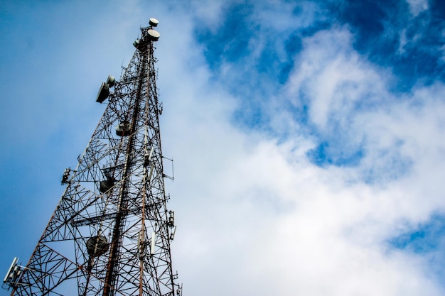 Low angle view of communications tower against sky