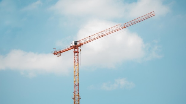 Low angle view of crane against sky